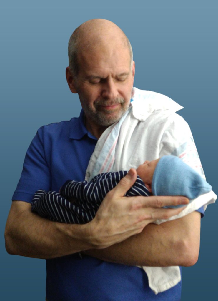 Dale Hamilton holding his newborn grandson.